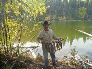 Guide with Fishing Haul - Swan Mountain Outfitters