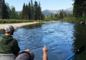 Patrick Tabor guiding a fly fishing float trip on the Swan River